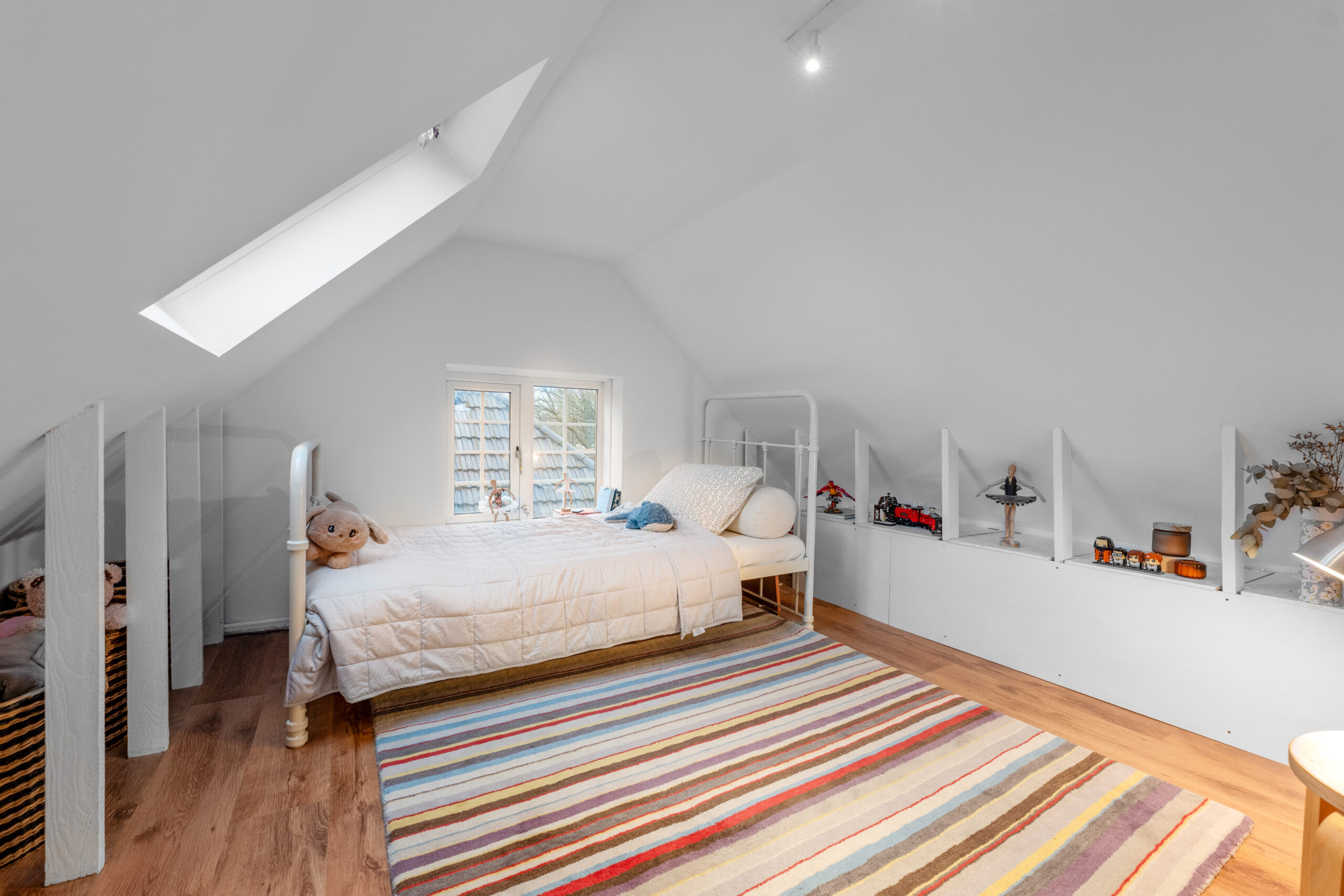 Bedroom with large stripe rug
