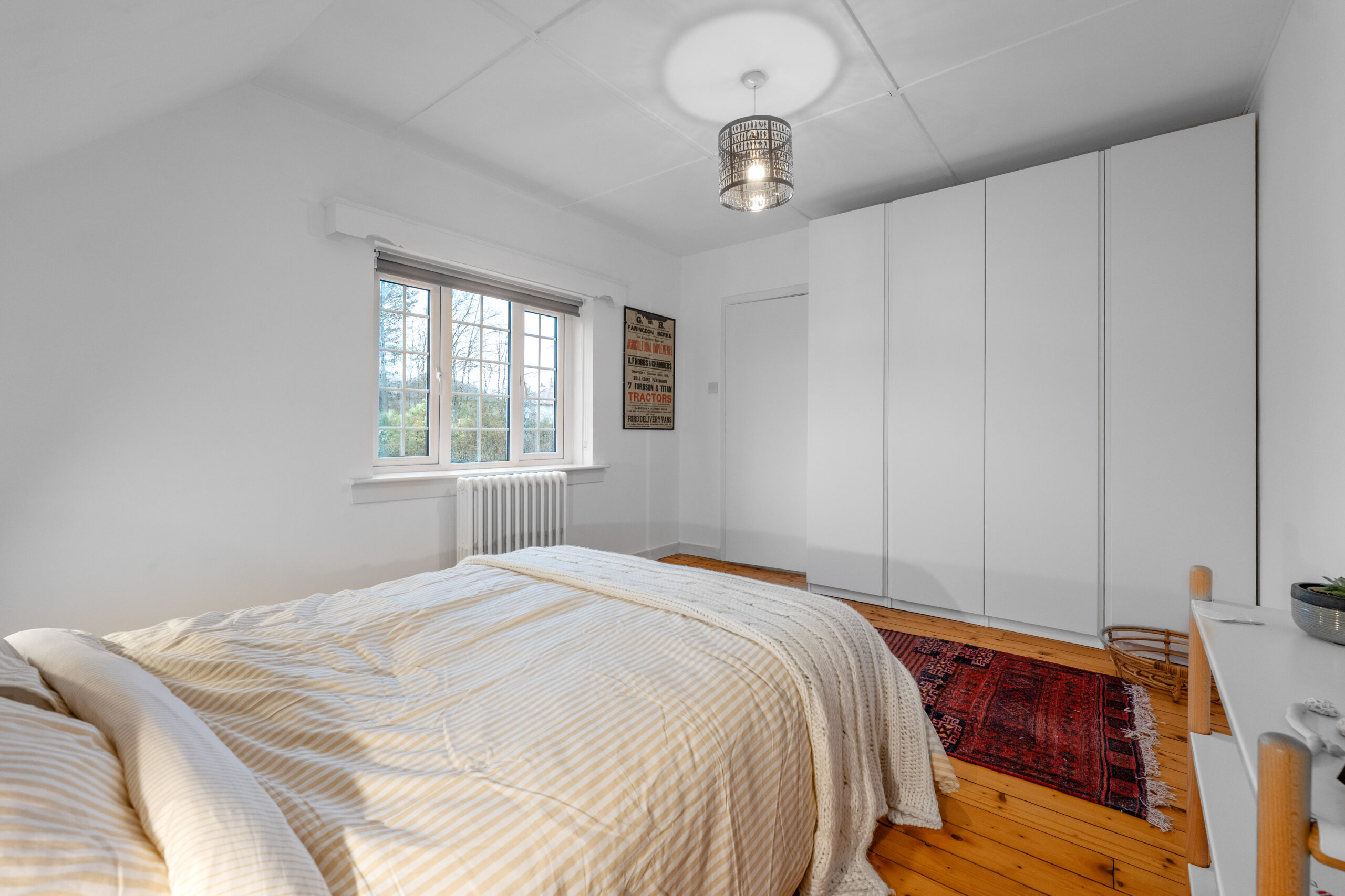 Bedroom with red rug 2