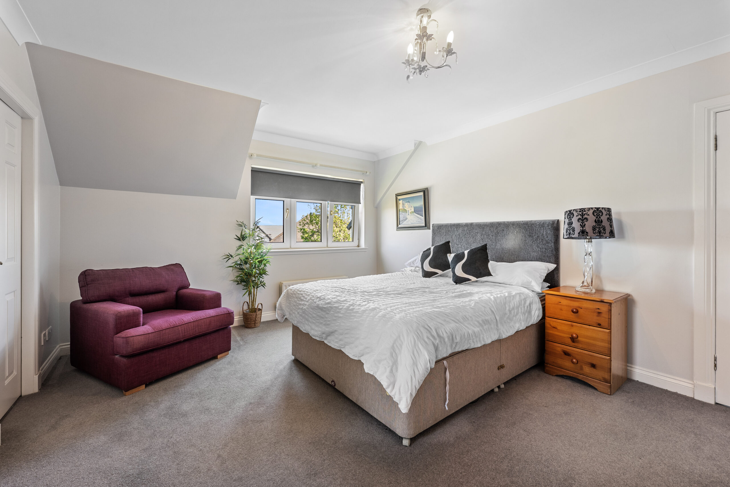 Bedroom with pink chair 1