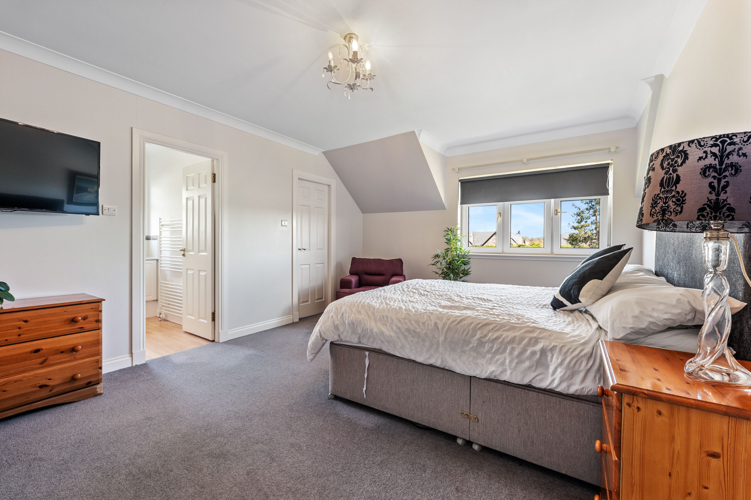 Bedroom with pink chair 2