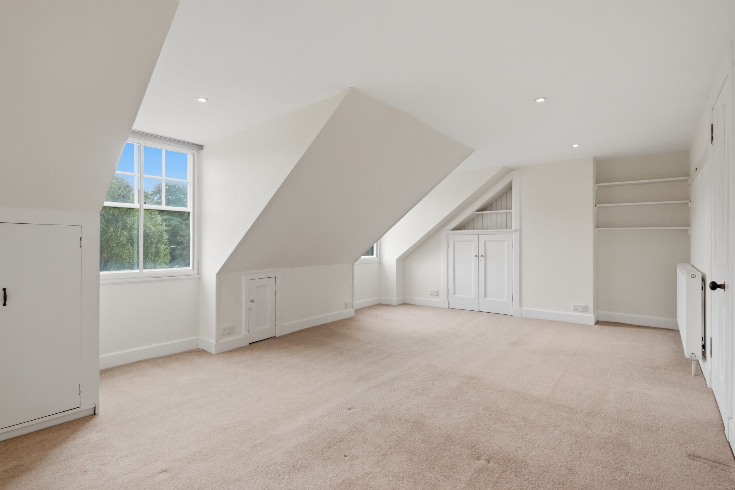 bedroom with two window and beige carpet 1