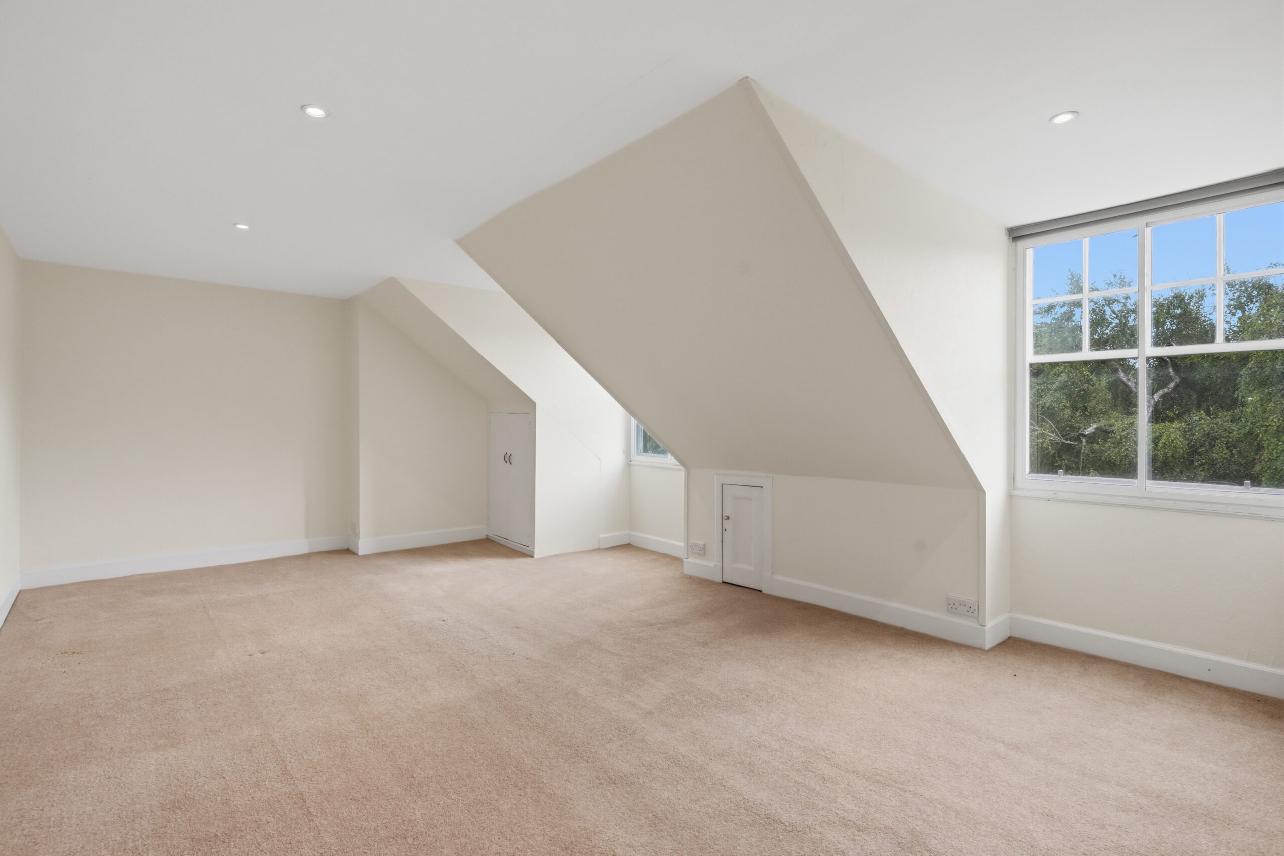 bedroom with two windows and beige carpet 2